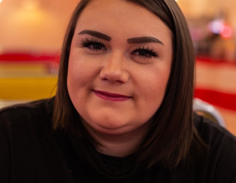 Woman in Black Shirt Smiling